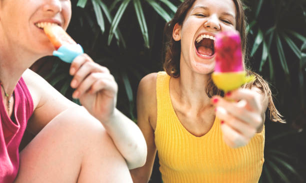 Employees enjoying ice cream from office vending machine